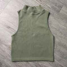 Zara Ribbed High Neck Sleeveless Crop Top Size: Xs-S Color: Green Never Worn - Great Condition, Zero Stains Very Soft, Great Basic Piece Stretchy Fitted Ribbed Sleeveless Crop Top, Fitted Sleeveless Ribbed Crop Top, Casual Ribbed Sleeveless Vest, Fitted Ribbed Sleeveless Vest, Zara Fitted Crop Tank Top, Fitted Zara Crop Top Tank Top, Fitted Tank Top By Zara, Fitted Zara Tank Top, Green Fitted Sleeveless Sweater Vest