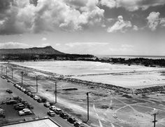 an empty parking lot with cars parked in it