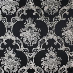 black and silver fabric with white flowers on the top, in an ornate pattern that is very