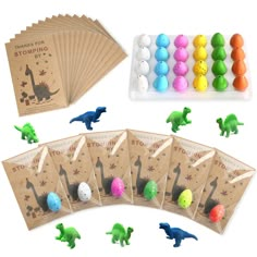 an assortment of dinosaur candies and chocolate eggs in bags with stickers on them