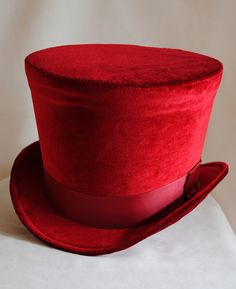 The Dandy is a simple and yet elegant victorian inspired top hat.It is covered with soft rich velvet in wine red.It is elegantly embellished with matching colored ribbon around the crown. Available in black, red(pictured) or ivory with matching ribbon. Need this TOP HAT in another color? with more decoration? Just send me a message to talk about a custom hat made just for you! This hat is fully lined with satin and it is made to according to your exact head measurement making it suitable for bot Red Fitted Hat For Costume, Red Fitted Top Hat For Winter, Red Brimmed Hat For Costume, Red Costume Hat, Red Fitted Vintage Top Hat, Vintage Red Hat For Costume Party, Vintage Red Hats For Costume Party, Red Vintage Adjustable Top Hat, Vintage Red Adjustable Top Hat