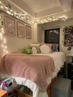 a bedroom with lights strung above the bed