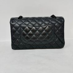 Chanel Classic Medium Double 2017 - 2018 Flap Bag with Black Hardware, Turn-Lock Closure at Front (includes Dustbag, Box and Authenticity Card) Designer = Chanel Color = Black Material = Leather Condition = Good Height = 6 Width = 10 Depth = 3" Class = Premier Location: Wilmette Item Number: 20201-62 Item ID: 300612 Category: Shoulder Bag High-end Black Bags With Detachable Strap, High-end Black Bags For Daily Use, High-end Black Bag For Daily Use, High-end Black Rectangular Bags, Black Double Flap Bag With Removable Pouch, Black Double Flap Bag For Daily Use, High-end Black Bag With Removable Pouch, High-end Black Shoulder Bag, High-end Bags With Cc Turnlock Closure And Double Flap