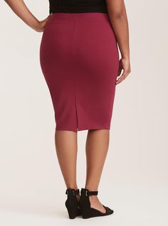 Thick ponte knit fabric stretches the way you need while smoothing you out and maintaining its shape. The wrinkle-free, no-fuss material lets you focus on the day ahead. Ponte fabric. Thick elasticized waist. Banded trim. Vented back. Pencil skirt silhouette. CONTENT + CARE: Rayon/nylon/spandex. Wash cold; line dry. Imported plus size skirt. SIZE + FIT: Model is 5'10”, size 1. Size 2 measures 27” from waist to hem. The best plus size women's midi studio luxe ponte pencil skirt skirts in burgundy made of studioponte. These dressy clothes and work-wear, office-wear, career-wear, and business-wear will make you look professional to nail your job interview and wear to work every day. Torrid is your destination for the freshest spring and summer styles. Stretch Solid Color Skirt For Workwear, Flattering Stretch Knee-length Bottoms, Stretch Knee-length Pencil Skirt In Solid Color, Versatile Stretch Pencil Skirt, Versatile Stretch Solid Color Pencil Skirt, Versatile Solid Color Stretch Pencil Skirt, Dressy Clothes, Plus Size Skirt, Ponte Fabric