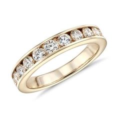 Both practical and pretty, a stunning row of round brilliant-cut diamonds is channel-set in polished 14k gold for a look that exemplifies classic design. Blue Nile Jewelry, Channel Set Rings, Rings Blue, Yellow Gold Diamond Ring, Channel Setting, Yellow Gold Wedding Ring, Round Diamond Ring, Sparkle Jewelry