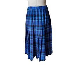 Vintage 70s Pendleton wool pleated skirt in shades of blue and black plaid. Zipper up the side and button waist. It is not lined. Composition - 100% virgin wool, made in USA. Marked size UK10 fits like a 8 US. Excellent vintage condition. Flat measurements: waist - 35 cm/ 13.8'' /there is lightly stretch/ length - 74 cm/29.1'' Blue Lined Pleated Skirt For Fall, Blue Fitted Pleated Skirt For Fall, Fitted Blue Pleated Skirt For Fall, Wool Pleated Skirt, Plaid Midi Skirt, Pendleton Wool, Cheongsam Dress, Black Plaid, Cheongsam