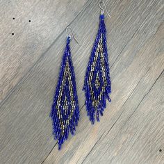 Absolutely gorgeous, patterned, seed bead woven fringe earring. 4 1/2” drop at longest length dipped stainless steel ear wire Blue Fringe Dangle Chandelier Earrings, Blue Long Drop Jewelry With Beaded Fringe, Blue Fringed Beaded Drop Earrings, Blue Fringe Beaded Drop Earrings, Fringe Earring, Bee Studs, Long Fringe, Long Fringes, Metal Trim