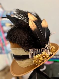 Gold cosplay hat additional gold and black trim ribbons and feathers Adjustable Costume Hats For Kentucky Derby Themed Events, Gold Costume Hats And Headpieces For Carnival, Mardi Gras Costume Accessories In Gold, Gold Mardi Gras Costume Accessories, Gold Costume Hats And Headpieces For Halloween, Gold High Crown Costume Hat, Adjustable Gold Costume Accessories For Cosplay, Adjustable Gold Costume Accessories, Gold Mardi Gras Cosplay Costume Accessories