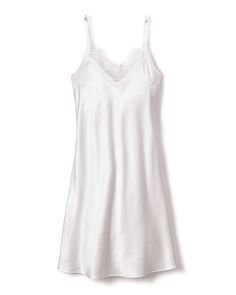 Petite Plume wishes you a “bonne nuit,” and in their luxury sleepwear, it’s hard not to oblige. Crafted from the softest 100% 22mm Mulberry silk, the Women's Silk Lace Slip Dress in White is the quintessential minimalist combination of luxury and grace. This stunning piece features delicate spaghetti straps, sweetheart neckline, and a body skimming tea length silhouette. Product Details 100% Mulberry silk. Care Instructions Wash only by hand or in a laundry bag in the washer in cold water. Dry f