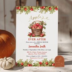 an apple cider themed birthday party with apples in a basket and pumpkins on the table