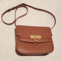 Used Once, Excellent Condition, Very Minor Creasing As Shown In Photos, Comes With Dustbag Daily Use Tan Shoulder Flap Bag, Tan Shoulder Flap Bag For Daily Use, Everyday Tan Flap Bag With Removable Pouch, Tan Flap Bag With Removable Pouch For Everyday Use, Tan Shoulder Box Bag With Gold-tone Hardware, Everyday Tan Flap Bag With Detachable Strap, Daily Use Saddle Shoulder Bag With Gold-tone Hardware, Satchel Flap Bag With Gold-tone Hardware, Elegant Saddle Bag With Adjustable Strap For Shopping