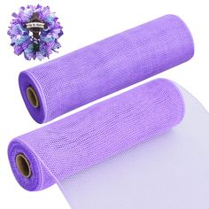 two rolls of purple tulle with flowers on top and one roll in the middle