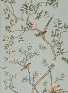 two birds are perched on the branches of a tree with white flowers and green leaves