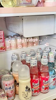 an open refrigerator filled with lots of drinks