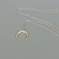 A Sterling silver neck chain with a crescent moon charm. Dimensions: 14.5 x 15.5 mm Length: 16 to 17 inches This necklace is made of 925 hypoallergenic sterling silver. Most of my pieces come with a 925 stamp. Please go through all the pictures posted for this item to gauge the actual size. Can be packaged in a gift box. I can include a personal message from you if needed You are welcome to contact me at... bhavnakwintra1956@gmail.com For more beautiful pieces from my shop, please browse 👇 SILV Silver Crescent Sterling Silver Charm Necklace, Silver Crescent Moon Phase Charm Necklace, Minimalist Crescent Moon Phase Charm Necklace, Silver Charm Necklaces With Moon Phase For Everyday, Silver Moon Phase Charm Necklaces For Everyday, Silver Crescent Charm Necklace For Everyday Wear, Everyday Silver Moon Phase Charm Necklaces, Everyday Silver Crescent Charm Necklace, Minimalist Sterling Silver Half Moon Charm Necklace