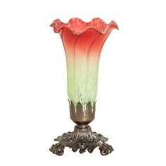 a red and green vase sitting on top of a metal stand