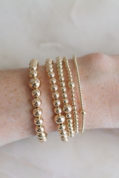 ❖MYLA BRACELET❖ *The all day-everyday-stackable bracelet!  ‣Our Myla Bracelets Feature:  *14k-Gold Filled Beads (high-quality, water + tarnish resistant, perfect for everyday wear!) *Available in 5 sizes: 2mm, 3mm, 4mm, 5mm, 6mm *Single larger bead (2mm + 6mm, 3mm + 5mm, 4mm + 6mm, 5mm + 7mm, 6mm + 8mm) *Tight/Sturdy elastic, pre-stretched to prevent bracelet from stretching out ‣Sizing Tips:  Please measure your wrist for the best fit!  *Using a soft tape measure/string, measure around your wrist, above the wrist bone *Add length according to your desired fit:       * 0" - fitted, snug      * .25" - slight movement      * .5" -  comfortable movement      * .75"- loose      * 1" - extra loose *Please message us if you need any help with sizing!  ------- ‣Each bracelet is made to order ‣We Everyday Stackable Gold Beaded Bracelets, Everyday Gold Stackable Beaded Bracelets, Dainty Hypoallergenic Stretch Bracelet For Everyday, Dainty Round Stretch Bracelet For Everyday, Minimalist Gold Beads Bracelets For Everyday, Minimalist Gold Beads Bracelet For Everyday, Minimalist Everyday Bracelet With Gold Beads, Everyday 14k Gold Filled Stretch Bracelet In Gold, Dainty 14k Gold Filled Stretch Bracelet For Everyday