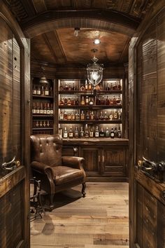 a chair in a room with wooden walls and shelves full of bottles on the wall