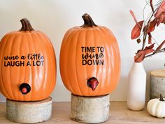 two pumpkins with time to laugh and laugh down written on them