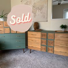 a sold sign sitting on top of a dresser