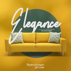 a yellow couch sitting in front of a green and white sign that says elegance on sale now