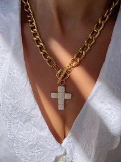 A handmade gold necklace with a unique Cross charm at the center that has a white type of stones on it that are made from enamel. The connection is at the front side with a circle part so it can not be adjusted. In Christina Christi Jewels store you can see more than 50 designs in Women's Necklaces. You can have them in 2-4 Days with DHL EXPRESS SHIPPING MATERIALS - Gold filled Chains are made from Aluminium. - White Cross charm made from brass with White type of stones on it (enamel). DIMENSION White Metal Clavicle Chain Jewelry, Handmade Gold Enamel Necklaces, Gold Enamel Necklace With Chain, Enamel Chain Jewelry As A Gift, Enamel Chain Jewelry As Gift, Enamel Chain Jewelry For Gifts, Gold Enamel Necklace With Adjustable Chain, White Cross Chain Jewelry, White Cross-shaped Chain Jewelry