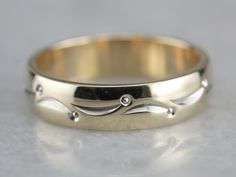 So lovely! This vintage piece is in the cigar band style, with a dotted lined pattern wrapping the ring, worn alone or against an engagement piece, this piece is sweet and timeless! Metal: 14K Yellow and White Gold Width of Band: 4.3 mm Height off Finger: 1.4 mm Ring Size: 4.50 Marks: "ARTCARVED{14KT" Stamped on the inside band Heirloom Jewelry With Decorative Band, Formal Rings With Decorative Wide Band, Anniversary Yellow Gold Band With Decorative Detail, Anniversary Yellow Gold Decorative Band, Elegant Engraved Ring With Thick Decorative Band, Modern Jewelry With Decorative Band For Anniversary, Elegant 14k Stamped Band Jewelry, Heirloom Diamond Ring With Decorative Band For Formal Occasions, 14k Gold Decorative Band For Anniversary