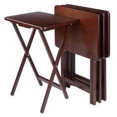 three wooden folding tables with one sitting on the top and another standing up against it