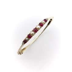 The centerpiece of this charming bracelet was most likely once a brooch, converted at some point into a stylish bangle. It contains six round half pearls and five oval-shaped cabochon rubies, prong-set into an alternating pattern, that has been beautifully incorporated into a knife edge bracelet. Each end of the bar culminates in triangular points, which marry into the knife edge for a clean and sophisticated look. The 14k gold bangle has a safety clasp to hold the bracelet securely on your wris Ruby And Pearl, Charming Bracelet, The Bangles, Gold Bangle, Gold Bangles, Prong Setting, Bangle Bracelets, Jewelry Bracelets, Ruby