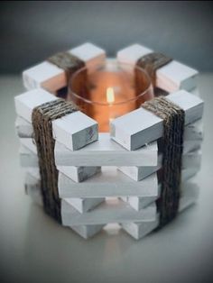 a candle holder made out of wood blocks