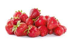 a pile of fresh strawberries on a white background