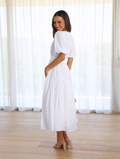 Dare to stand out in this KIMONA SMOCKED MAXI DRESS. The flowy skirt and puff short sleeves create an effortless yet powerful style. Make a bold statement in this summer staple. Size Guide: Model is 5’6” tall, and has a 33.2” bust, 26.4” waist, & 35.2” hips. She is wearing a S / US 4 / AU 8. This dress is true to size. Material: 100% Rayon. Feature: Maxi length. Puff sleeves. V-neckline. Flowy Skirt. Care Instructions: Machine wash / Cold hand wash Smocked Maxi Dress, Short Sleeve Maxi Dress, Reindeer Headband, Short Sleeve Maxi Dresses, Sleeve Maxi Dress, Summer Staples, Daily Dress, Dress Jewelry, Flowy Skirt