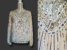 "ALL SALES FINAL. No returns because an item does not fit. Measurements provided are accurate and checked over many times before listing. reach out if you require help determining fit before purchasing. I am happy to help! If sparkling champagne is your style, this silk beaded and sequined 80's blouse is ready for you! Made in India, pure silk, beautiful sequins and beadwork. Sleeves have a whole lot of balloon and are semi sheer. What I love about this one is the neckline. Nice wide boat neck s Vintage Embellished Tops For Fall, Long Sleeve Sequin Top For Celebration, Vintage Beaded Tops For Party, Fall Party Beaded Tops, Vintage Beaded Tops For Night Out, Vintage Beaded Top For Night Out, Long Sleeve Beaded Party Tops, Glamorous Beaded Tops For Party Season, Vintage Embellished Tops For Festive Occasions