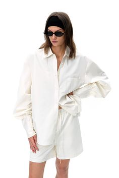 Classic White with a Modern Twist Elevate your wardrobe with this oversized white shirt, a perfect blend of classic and contemporary elements. The shirt features a loose fit with dropped shoulders, creating a relaxed yet refined silhouette that¡¯s ideal for both casual and formal wear. The high-quality fabric offers a soft and comfortable feel, making it an excellent layering piece or a standalone statement. Designed with modern sensibilities, this shirt is versatile enough to complement various Designer White Shirt, Long Sleeve White Shirt, Oversized White Shirt, Tank Top Skirt, Black Backless Dress, Casual Activewear, Contemporary Elements, Silk Knit, White Long Sleeve Shirt