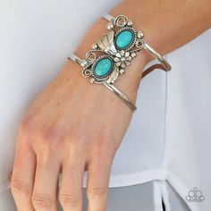 A Leafy Silver Flower Blooms Between Two Oval Turquoise Stones Atop A Studded And Filigree Filled Backdrop, Creating A Subtly Slanted Centerpiece Across An Airy Silver Cuff. Spring Bohemian Turquoise Jewelry, Blue Casual Jewelry For Spring, Casual Blue Jewelry For Spring, Beach Wedding Red, Orange Bracelet, Feather Bracelet, Purple Bracelet, Woven Bracelets, Turquoise Stones