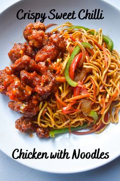 a white plate topped with noodles and meat