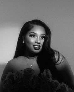 a black and white photo of a woman with long hair