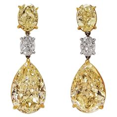 From SCARSELLI, world-renowned for investment grade natural fancy color diamonds, comes this 3 stones dangled earrings GIA certified: 2 matched pair Fancy Yellow pear shape of 8+ carat each, beautifully cut for dazzling brilliance, hanging from a totaling 1 carat oval F color diamonds VVS and VS clarity respectively. A matching pair of fancy yellow ovals 1.5 carat each at the top set on a platinum and 18k gold handmade setting to display these amazing Scarselli stones (see certificates pictures Luxury Yellow Gold Jewelry For Vintage Events, Luxury Yellow Gold Danglers For Women, Marquise Diamond Earrings, Expensive Earrings, Pink Diamond Earrings, Yellow Diamond Earring, Colored Diamond Jewelry, Fine Jewelry Earrings, Diamonds Earrings