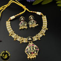 Our special Handcrafted fusion necklace is curated on brass ,hand painted and meena work on real stones pendant. This is a absolutely gorgeous and trending Piece.Metal: Brass with 92.5 SilverPolish: Gold Nickel FreePerfect for all occasion(Party, Wedding ,Engagement)Note: This product is handcrafted and vintage, it has slight irregularities in design which only add to its beauty. Due to the differences in displays of computers/laptops/phones or may be photographic lighting sources the color of t Kundan Chandbali Necklaces For Gift, Kundan Chandbali Necklaces As Gift, Festival Kundan Necklace, Hand Set, Ideal For Gifts, Hand Set Kundan Necklace As Festival Gift, Kundan Necklace Hand Set For Festivals And Gifts, Kundan Necklaces For Diwali Gift, Hand Set Chandbali Kundan Necklace As Gift, Meenakari Pendant Jewelry For Puja, Festive Kundan Necklaces As Gifts