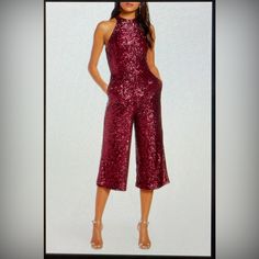 Set A Shining Example Of What It Means To Serve Up Sparkling Style In A Smashing Jumpsuit Covered In Sequins And Cropped To Perfection. This Jumpsuit Is A Cranberry Red Color. 9some Of The Pictures Show Different Colors But The One I Have Is Red.) 49" Length (Size 6) Hidden Back-Zip Closure Halter-Style Mock Neck Sleeveless, With Cutaway Shoulders Side-Seam Pockets Lined 95% Polyester, 5% Spandex Dry Clean Imported Glamorous Sleeveless Jumpsuits For Holidays, Fitted Holiday Jumpsuits And Rompers, Fitted Jumpsuits And Rompers For Date Night Holiday, Chic Red Pantsuit For Party, Glamorous Red Jumpsuits And Rompers For Party, Burgundy Bottoms For Summer Party, Red Holiday Jumpsuits And Rompers For Evening, Red Holiday Jumpsuits And Rompers For Night Out, Red Jumpsuits And Rompers For Holiday Night Out