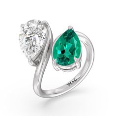 Pick this ring if you're searching for a modern minimalist engagement ring that tells a story and tells it in a simply romantic way. This toi et moi or you-and-me ring perfectly depicts the meeting of two souls. It features a slim yet curvy bypass shank, with each end topped with a pear-cut created Emerald and diamond on a three-prong basket setting. Modern Open Ring With Vs Clarity For Wedding, Modern Green Diamond Anniversary Ring, Elegant Tension Setting Ring With May Birthstone, Modern Round Cut Birthstone Ring For Anniversary, Modern Green Diamond Promise Ring, Solitaire Diamond Open Ring For Proposal, Modern Emerald Ring Vvs Clarity For Promise, Solitaire Diamond Proposal Ring, Open Style, Solitaire Diamond Proposal Ring Open Shape