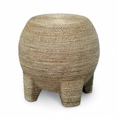 an elephant shaped basket sitting on top of a white floor