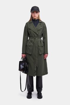 Utility Long Coat For Work, Belted Gabardine Outerwear For Work, Khaki Belted Gabardine Outerwear, Khaki Gabardine Belted Outerwear, Khaki Belted Long Coat, Long Travel Coat With Pockets, Long Coat With Pockets For Travel, Belted Long Raincoat For Fall, Fall Workwear Raincoat With Pockets