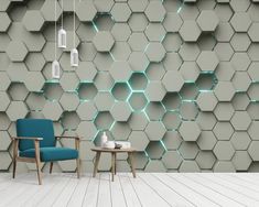 a chair and table in front of a wall that has hexagonal tiles on it