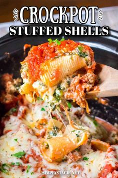 the crockpot stuffed shells recipe is being lifted out of the slow cooker