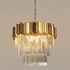 a gold chandelier hanging from a ceiling