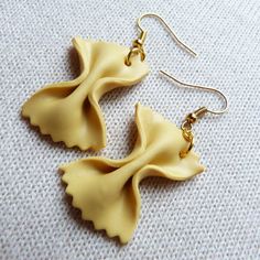 the earrings are made out of yellow plastic