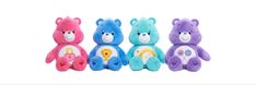 three different colored teddy bears sitting next to each other