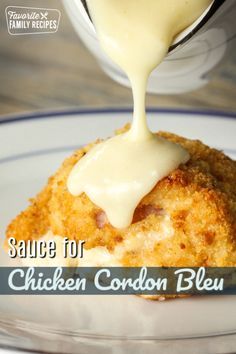 chicken cordon bleu sauce being drizzled on top of it