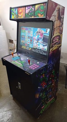 an arcade machine sitting on top of a floor